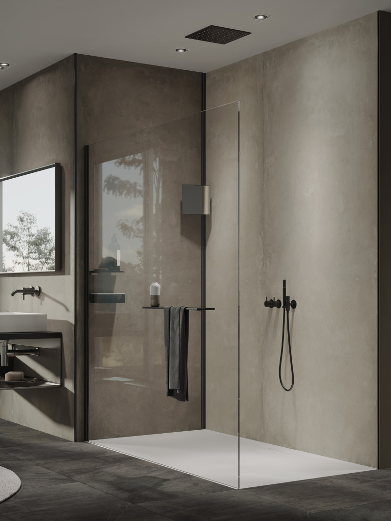 Flat shower tray built into the floor in a modern bathroom