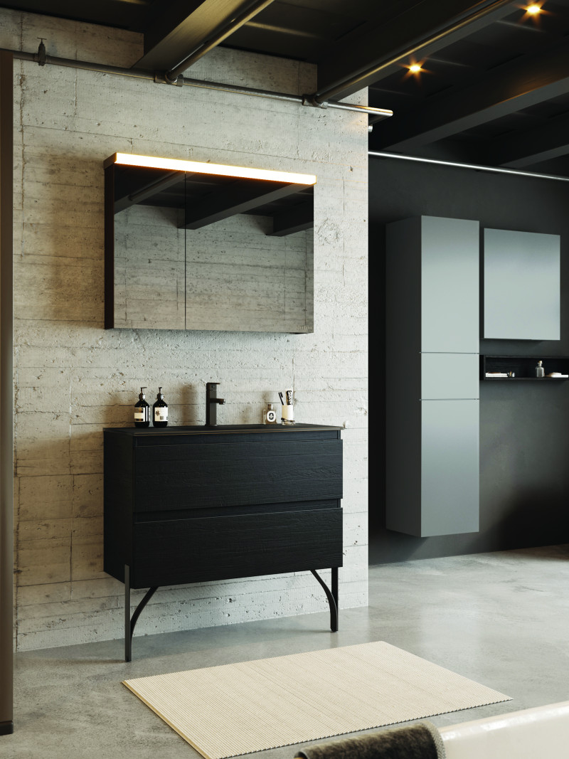 A spacious bathroom featuring a variety of materials (polished concrete, metal, wood)