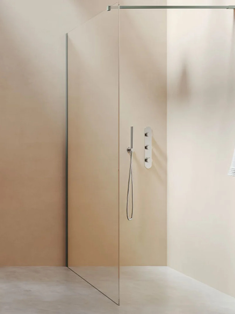 Minimalist bathroom with a fixed glass shower screen