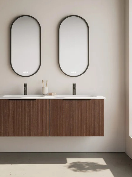 Handleless double vanity bathroom cabinet in dark wood with flat fronts and oval mirrors, contemporary design to visually enlarge the room